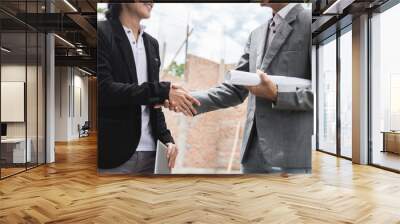 designers discussing construction plan shaking hand Wall mural