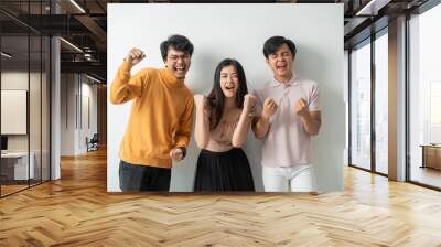 group of young people by celebrating their success and free with an isolated background Wall mural