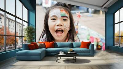 happy asian Child preschooler with face painting. Make up. Wall mural