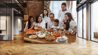 happy asian family tradition having lunch together on christmas day at home Wall mural