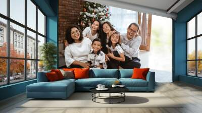 happy smiling big family with grandparents, parents and child together at home celebrating christmas day Wall mural