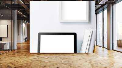 laptop on working desk and frame on white wall Wall mural