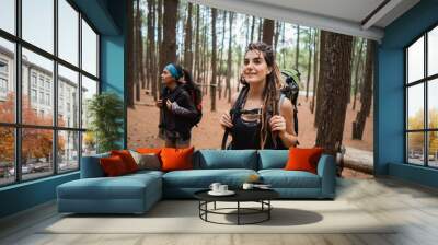 two young female hiker walking in beautiful nature Wall mural