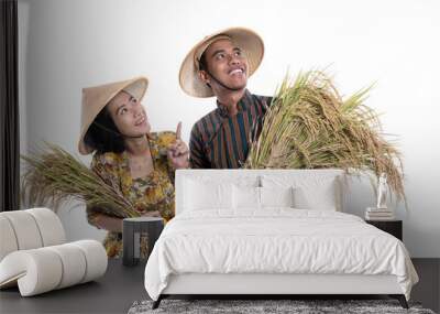 young asian couple farmer looking up to copy space while holding rice grain together Wall mural