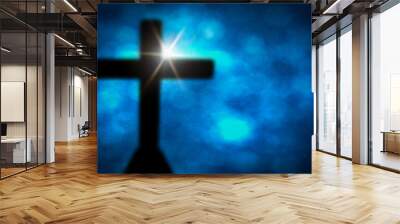 cross with blue bokeh background Wall mural