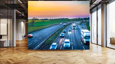 Colourful sunset at M1 motorway near Flitwick junction with blurry cars in United Kingdom. Wall mural