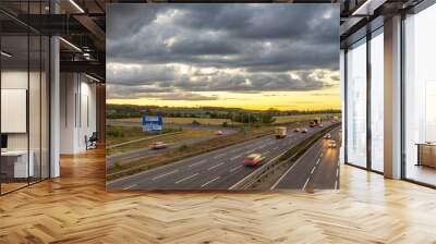 Colourful sunset at M1 motorway near Flitwick junction with blurry cars in United Kingdom Wall mural