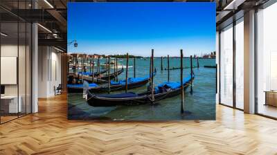 gondolas moored by saint mark square with san giorgio di maggiore church on the background in venice Wall mural