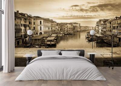 Vintage and panoramic view on famous Grand Canal among historic houses in Venice, Italy at sunrise. Picture took from the Rialto bridge. Wall mural