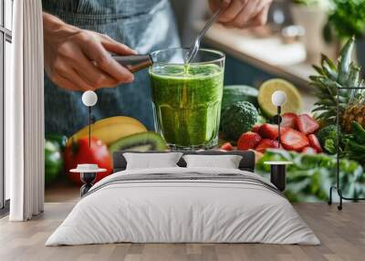 Close-up of a person preparing a healthy smoothie in a bright kitchen, with fresh fruits and vegetables spread out on the counter, symbolizing balanced nutrition and well-being Wall mural