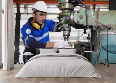 factory worker or technician checking and control lathe machine in factory Wall mural