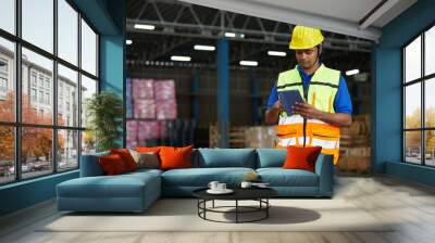 factory worker working on tablet in the warehouse storage Wall mural