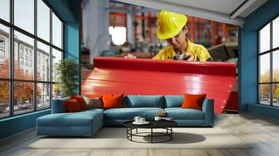 worker or technician holding and checking quality metal sheet in the factory Wall mural