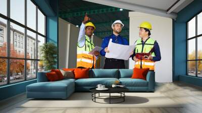 workers or engineers planning from work on blueprint drawing paper in the factory Wall mural