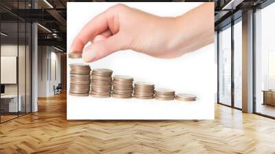 Woman hand stacking US quarters into increasing columns     Wall mural