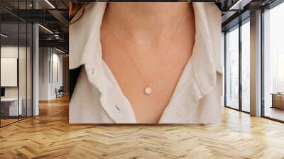 Close-up young woman wearing gold chain necklace. Modern fashion details. minimalist lifestyle Wall mural