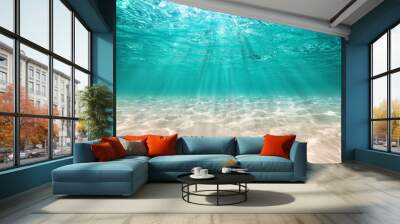 underwater background  deep blue sea and beautiful light rays with sandy floor Wall mural