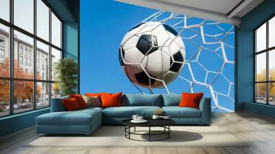 Soccer football in Goal net with the sky field. Wall mural