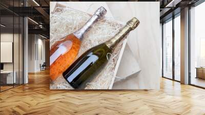 champagne bottles in a wooden box on a wooden background Wall mural