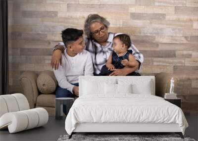 Happy moments with grandma, indian or asian senior lady spending quality time with her grand children  Wall mural