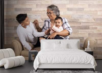 Happy moments with grandma, indian or asian senior lady spending quality time with her grand children  Wall mural