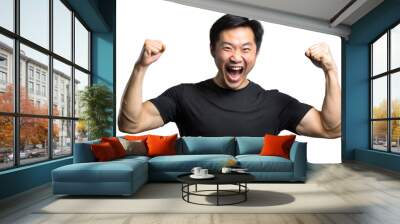 Excited Asian Man Wearing Black T-Shirt With Arms Raised In Victory Wall mural