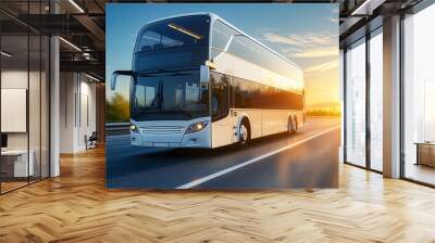 Modern double decker bus traveling on highway at sunset Wall mural