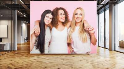 Three happy friends girls at studio have party Wall mural