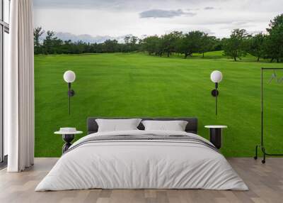 Golf Course with beautiful green field. Golf course with a rich green turf beautiful scenery. Wall mural