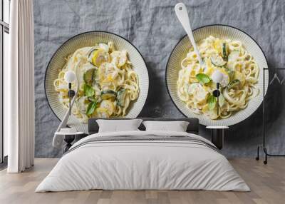 Creamy zucchini pasta with parmesan and basil top of a grey table. Delicious healthy food Wall mural