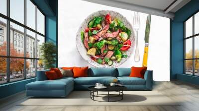 Potato, beef steak, fresh greens and vegetable salad on a light background, top view. Balanced diets healthy food Wall mural