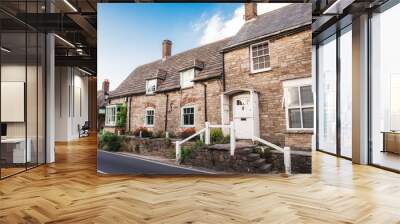 Charming streets of old English traditional stone cottage. Selective focus, copy space. Wall mural