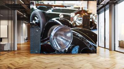 Headlight lamp black vintage classic car with vintage effect style pictures. Black classic car concept. Selective focus. Copy space. Wall mural