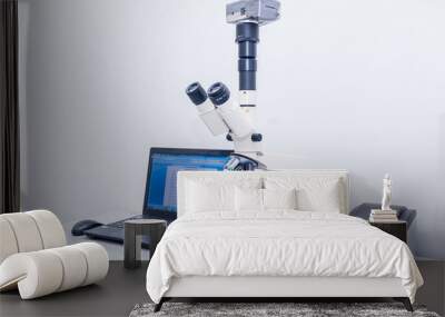 Modern microscope equipped with digital camera and computer in clinic laboratory. Selective focus Wall mural