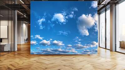 Beautiful cloudscape panorama view of bright blue sky filled with white fluffy clouds Wall mural