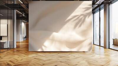 Beige satin fabric texture background with shadow of leaves. Top view flat lay. High quality photo Wall mural