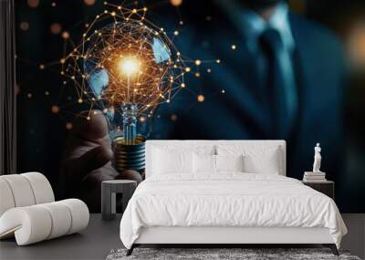 Businessman holding light bulb connected with network concept for idea innovation and inspiration Wall mural