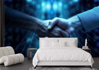 Close up image of business handshake against blue glowing background. Partnership concept Wall mural