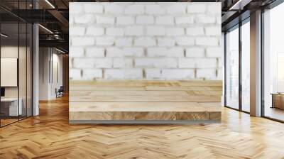 Empty wooden tabletop over blurred white brick wall background for product display montage Wall mural