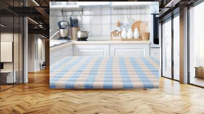 Kitchen interior with a blue and white checkered tablecloth over a table, blurred background. High quality photo Wall mural