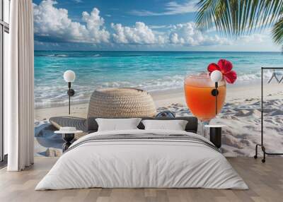 Refreshing tropical cocktail on a white sand beach with a straw hat and sunglasses, ocean waves and palm leaves in the background. High quality photo Wall mural