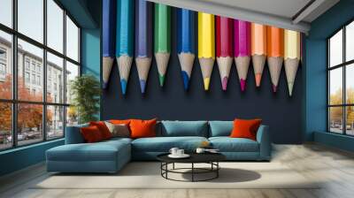 A close-up image of vibrant, sharpened color pencils. School theme Wall mural