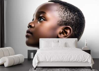 A close-up side view portrait of an African small boy with black skin against a white background, Wall mural