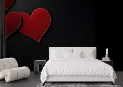 A pair of red hearts on a dark backdrop, perfect for love-themed banners and messages. Red Hearts on Black Banner Background Wall mural