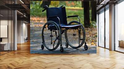 An empty wheelchair sits alone  Wall mural