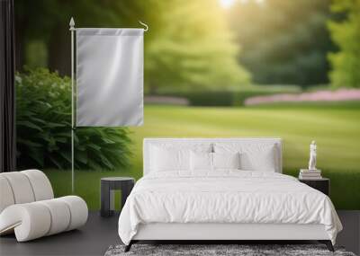 Blank garden flag on green grass on the park background. Garden flag mockup Wall mural