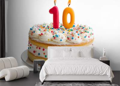 Cake with a number 10 birthday candle, isolated on a plain white background. Wall mural