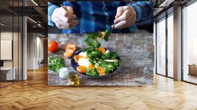 Chef preparing a healthy salad. Male hand mixed salad with mozzarella and tangerine. Salad a la caprese with corn salad and mandarin. Wall mural