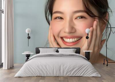 Closeup Beautiful smiling asian korean woman touch face with smooth healthy skin Wall mural