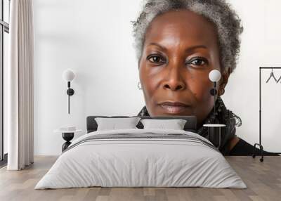 Closeup photo portrait of a elderly mature black skin woman smiling isolated on white background Wall mural